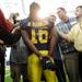 Michigan junior quarterback Denard Robinson gives an interview during media day at the Al Glick Field House on Sunday.  Melanie Maxwell | AnnArbor.com